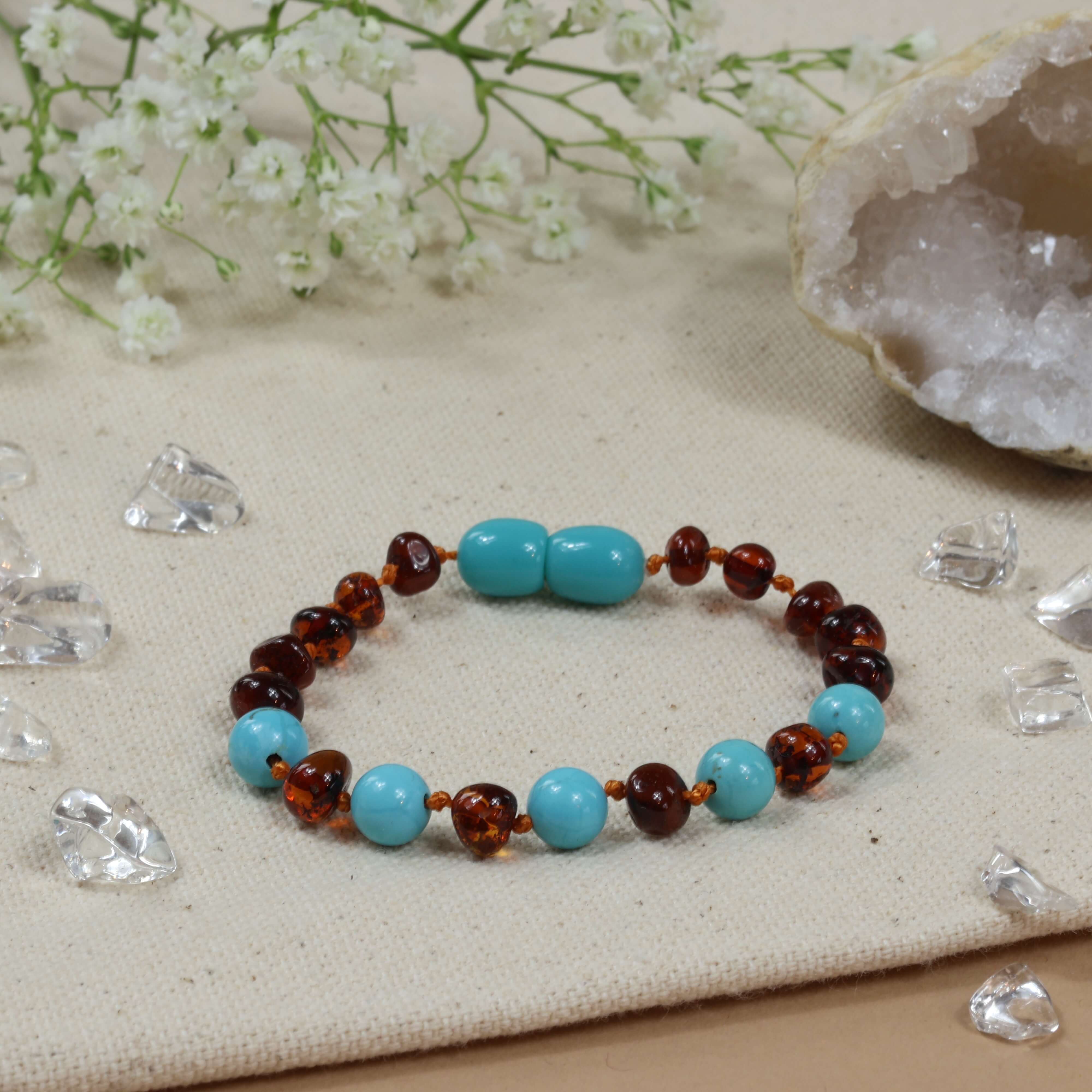 Baby Natura Barnsteen armband baby/peuter cognac - turquoise Baby Natura Barnsteen armband baby/peuter cognac - turquoise