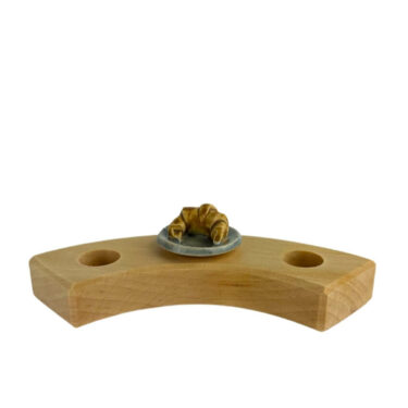 Croissantje op een bordje steker Croissantje op een bordje steker